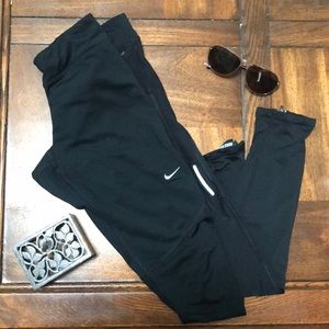 Nike leggings w zippers on the back of the calf